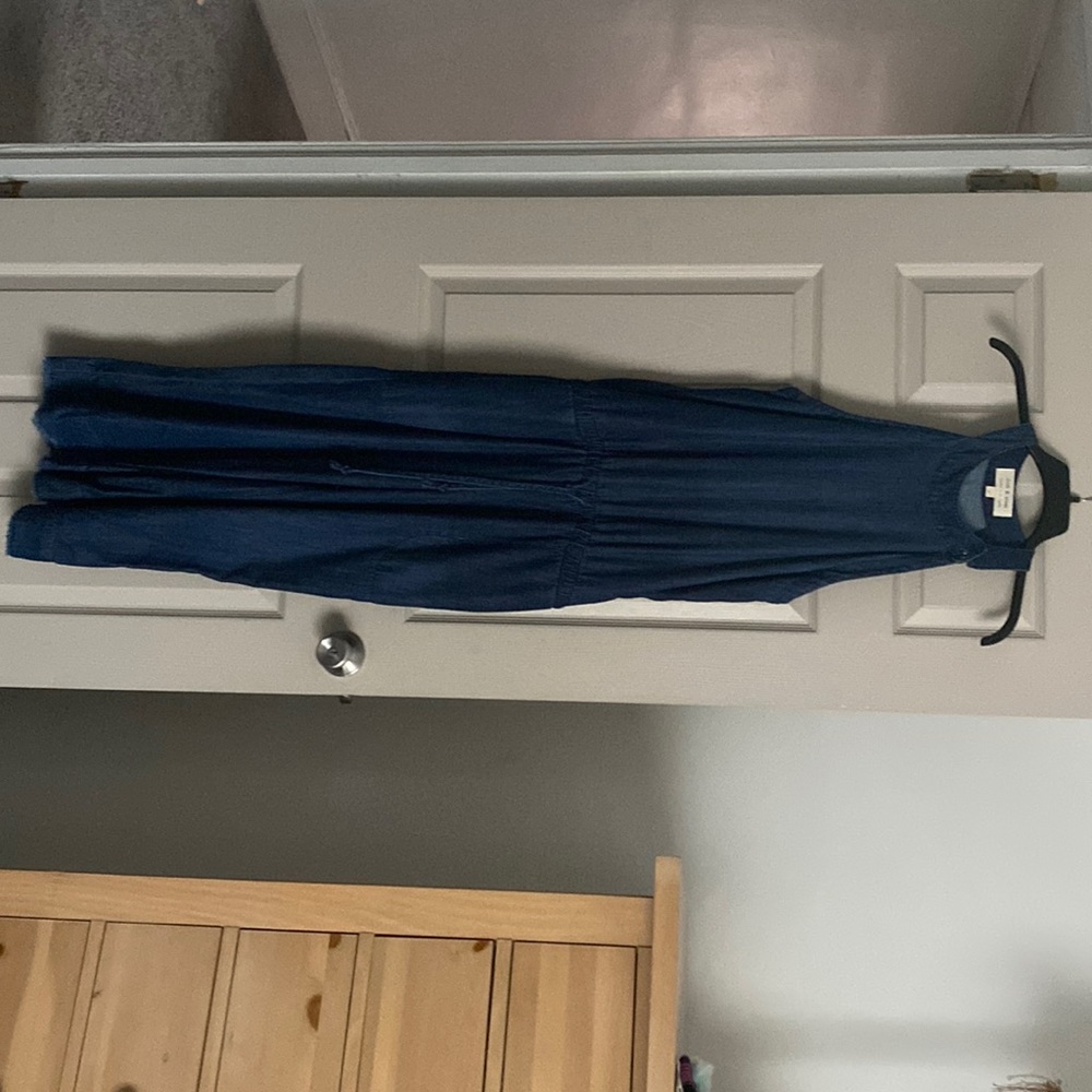 A denim jumpsuit w/side pockets